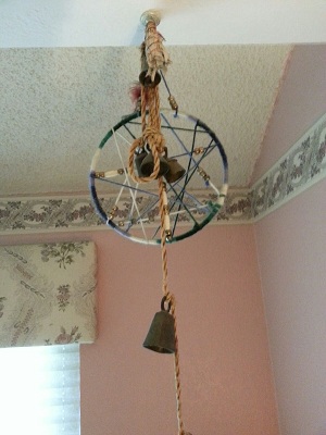 Her dream catcher, sage and prayer bells.